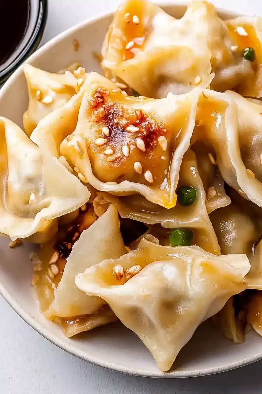 Pork Wontons w/ Spicy Sauce